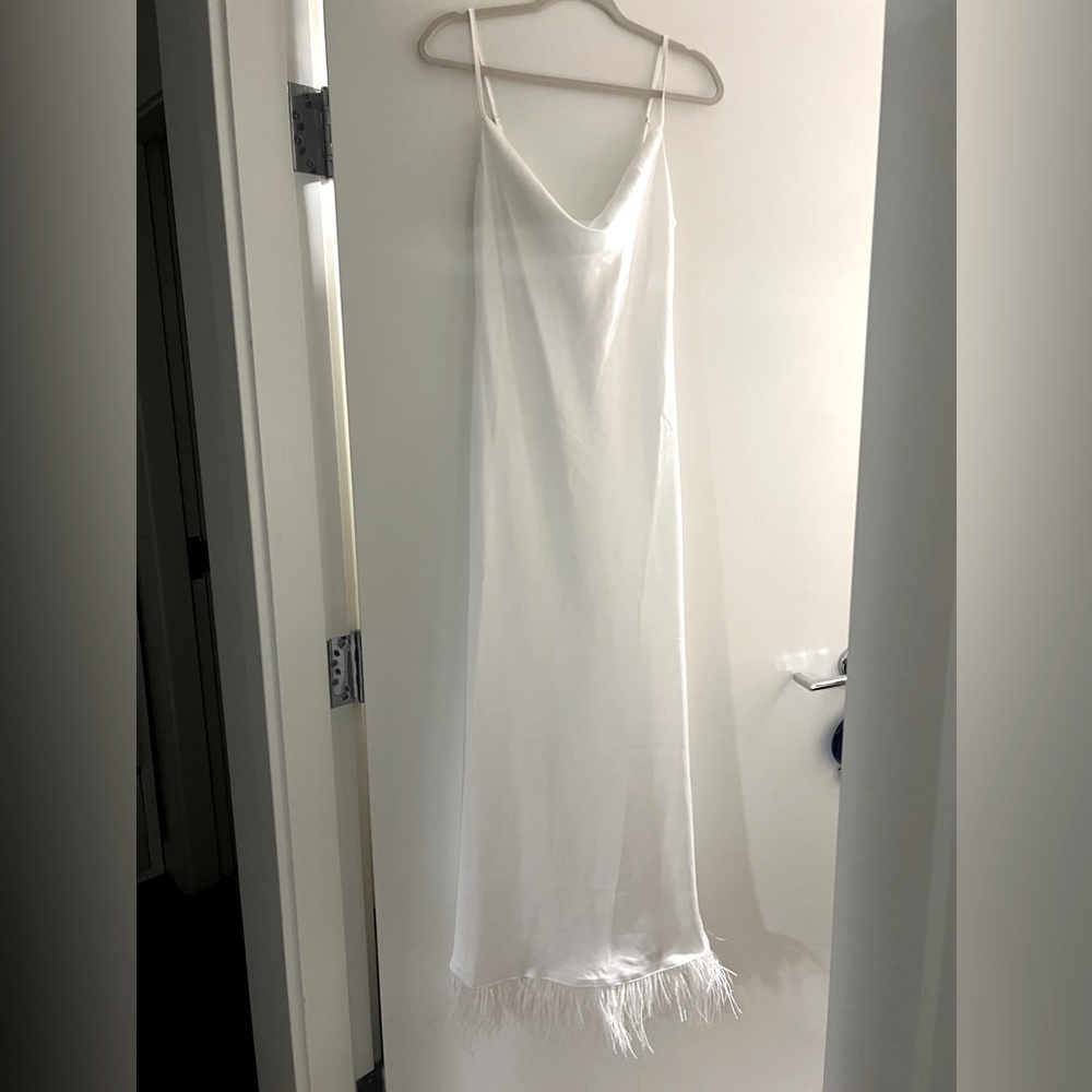White maxi dress with feathers